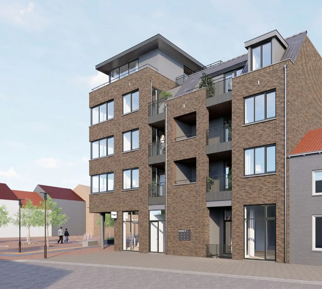 Impressie van de straatgevel van La Licorne met balkons en de entree van de appartementen